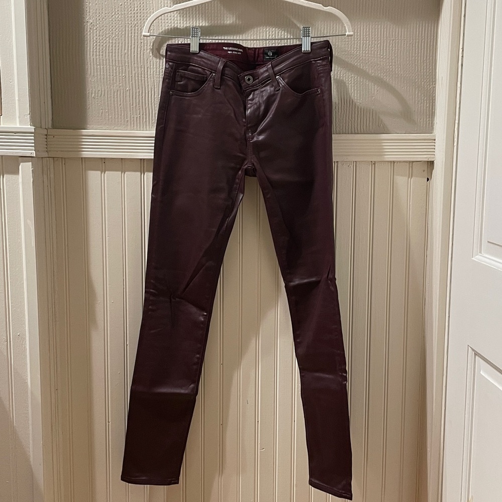 Burgundy skinny coated pants by AG size 25